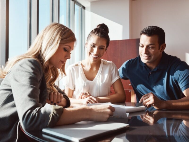 financial adviser speaking with clients