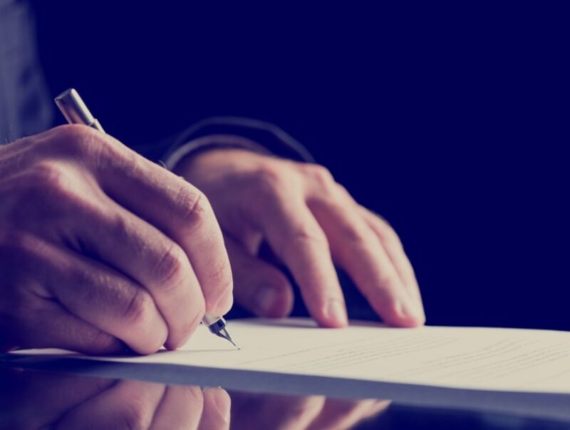 A person signing a document