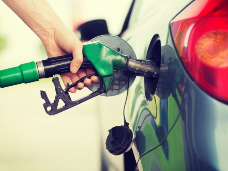 A person filling their car with petrol