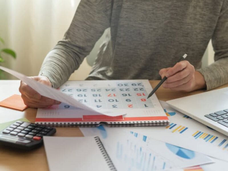 A person looking at a calendar