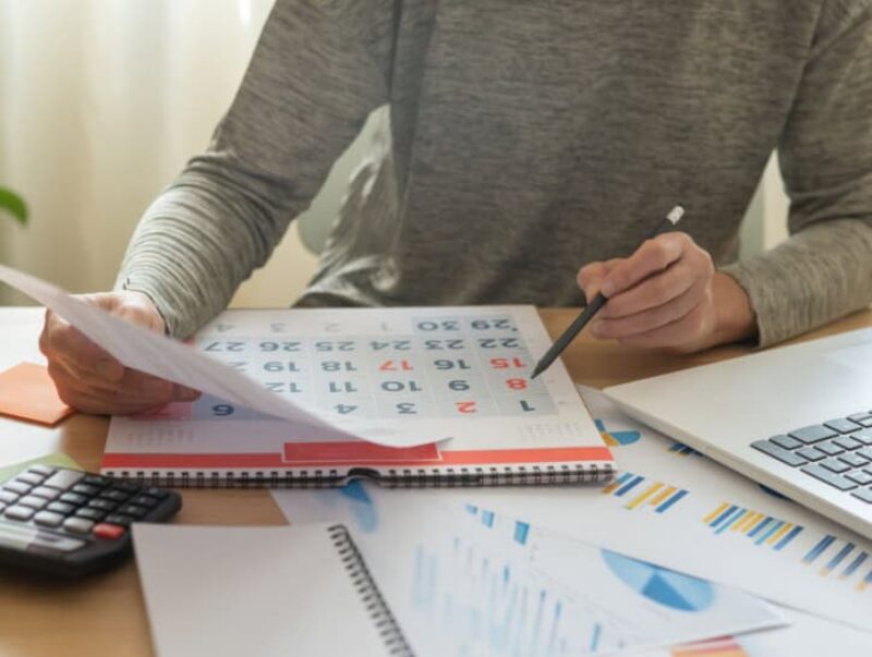 A person looking at a calendar