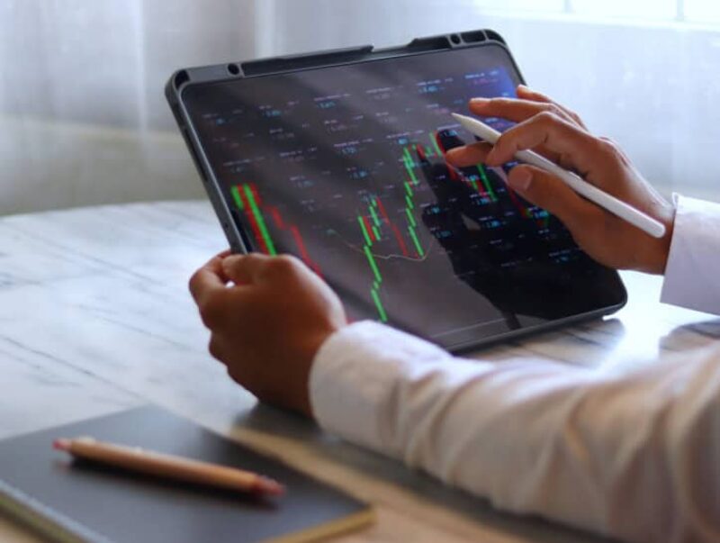 A man checking investment graphs