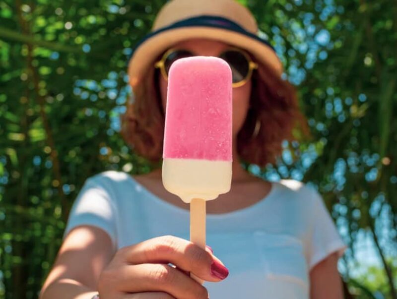 woman holding an ice lolly