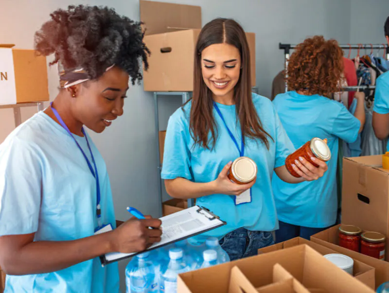 A group of people work at a food bank