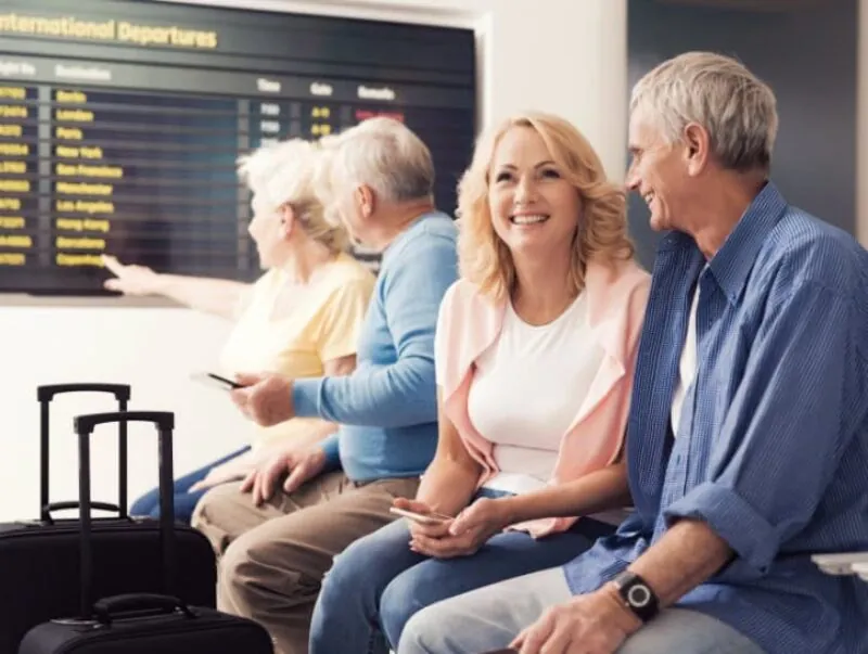 A couple waiting in the lounge at the airport
